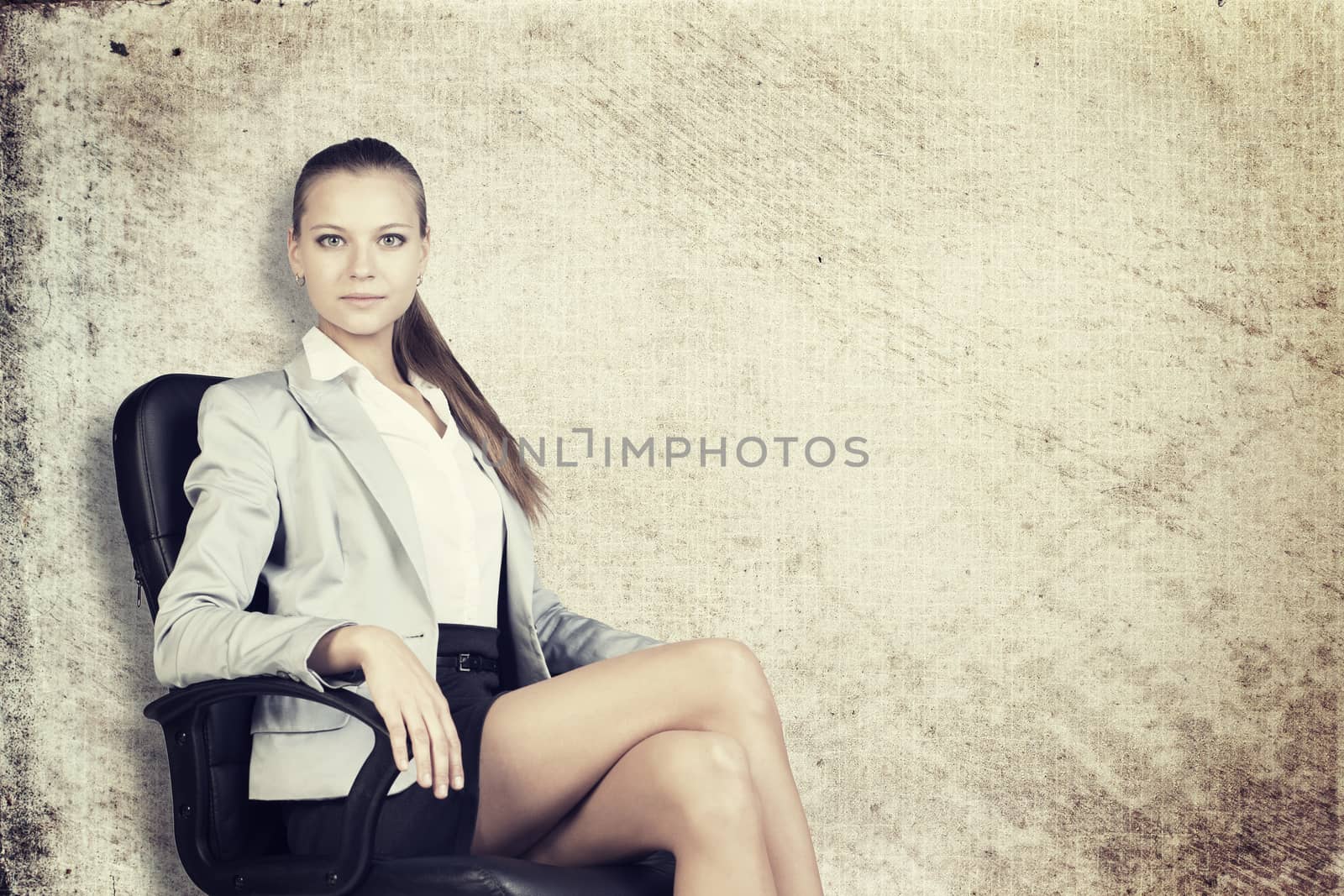 Businesswoman in office chair, looking at camera, over grunge scratchy background