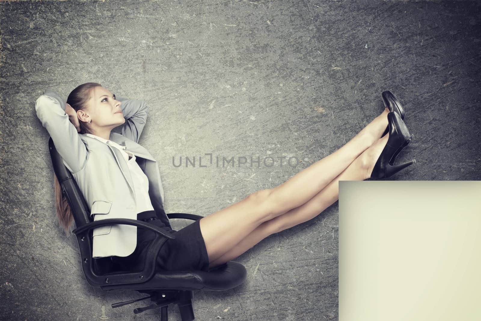 Businesswoman in office chair put her hands behind her head, with her feet up on anything, over grunge scratchy background