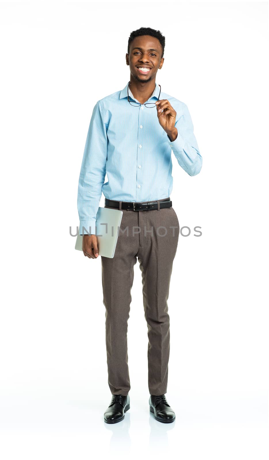 Happy african american college student standing with laptop on white background