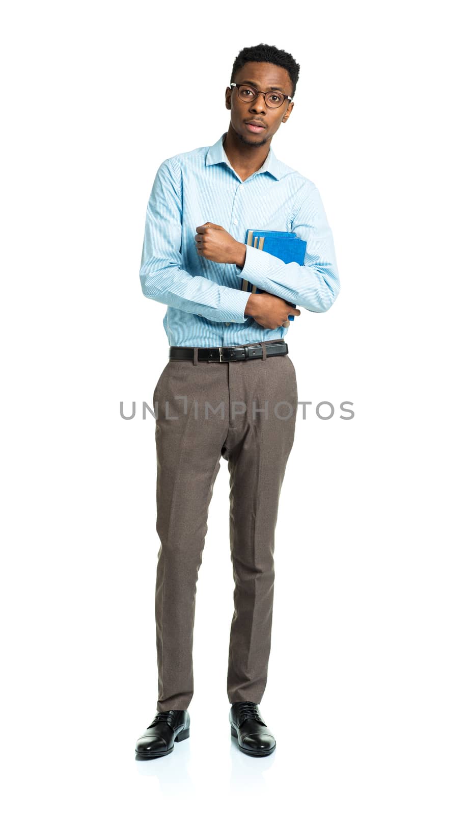 Happy african american college student standing with books in his hands on white background