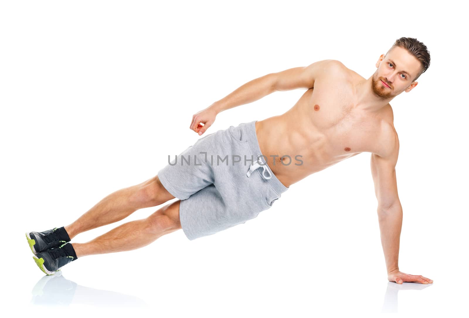 Sport attractive man doing fitness exercises on the white background