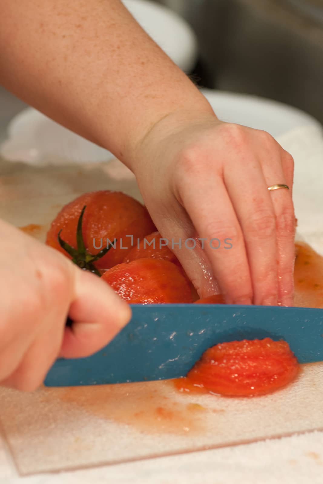 Cutting tomatoes by SouthernLightStudios