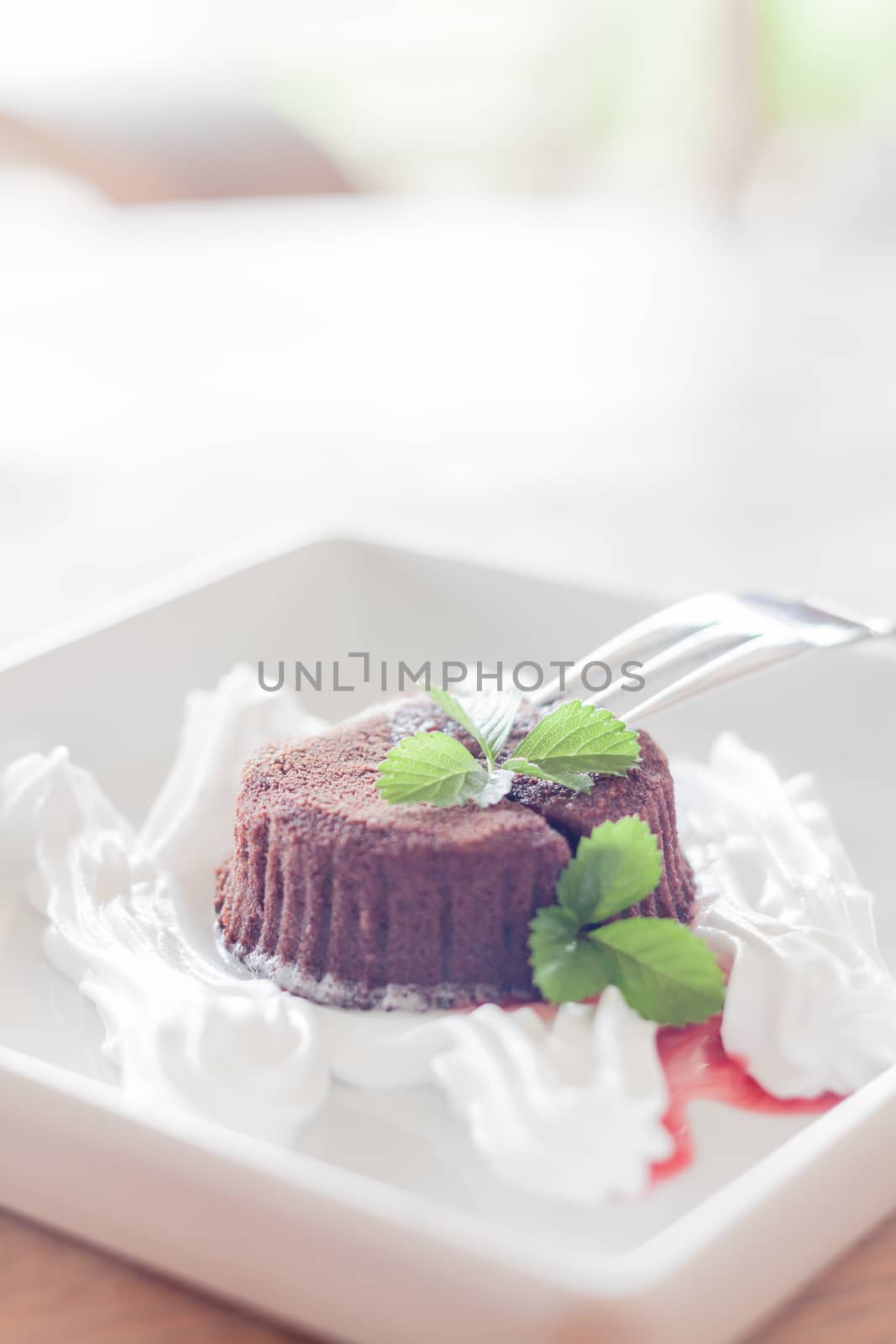 Chocolate lava with fork for serving by punsayaporn