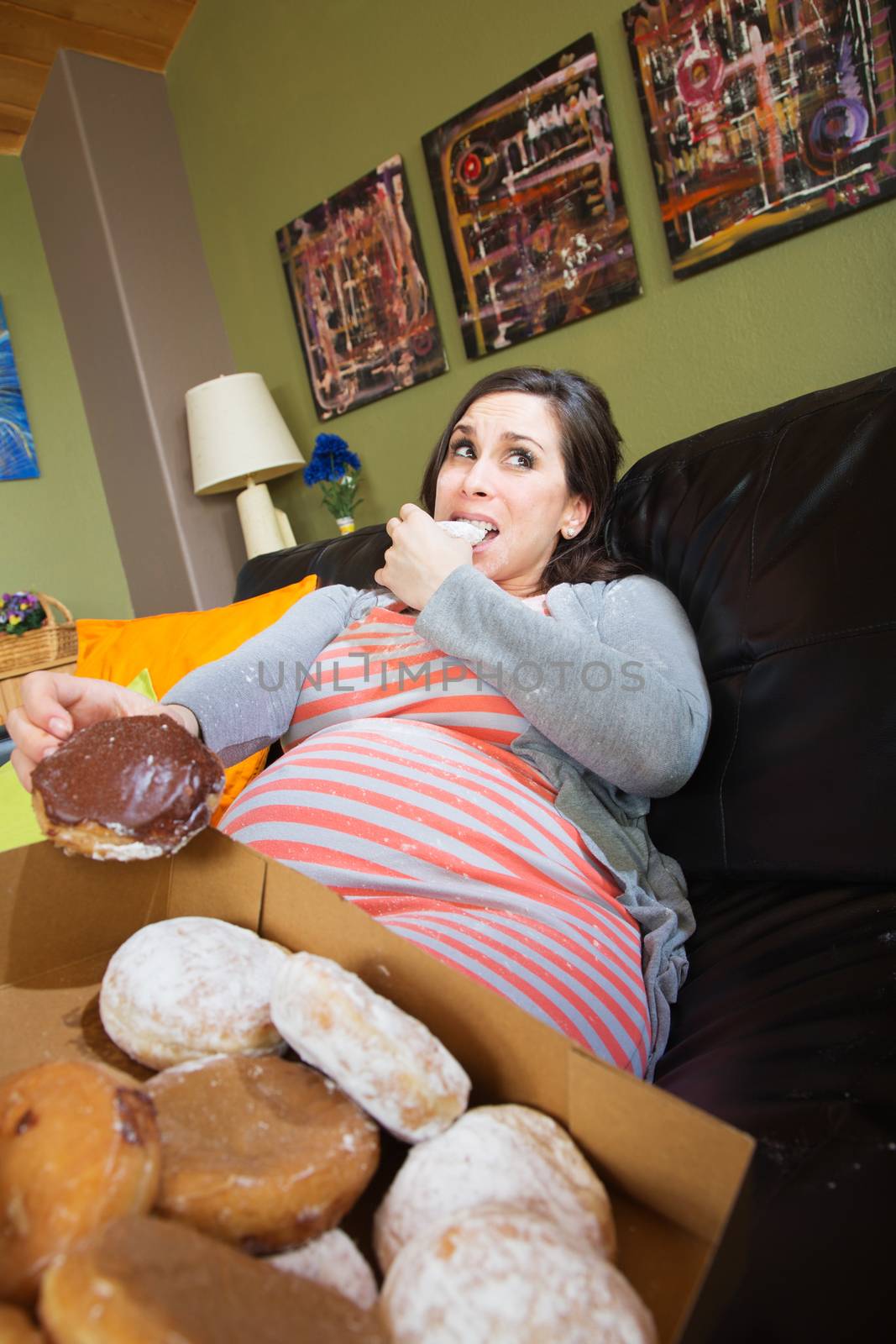 Pregnant Woman Eating Donuts by Creatista