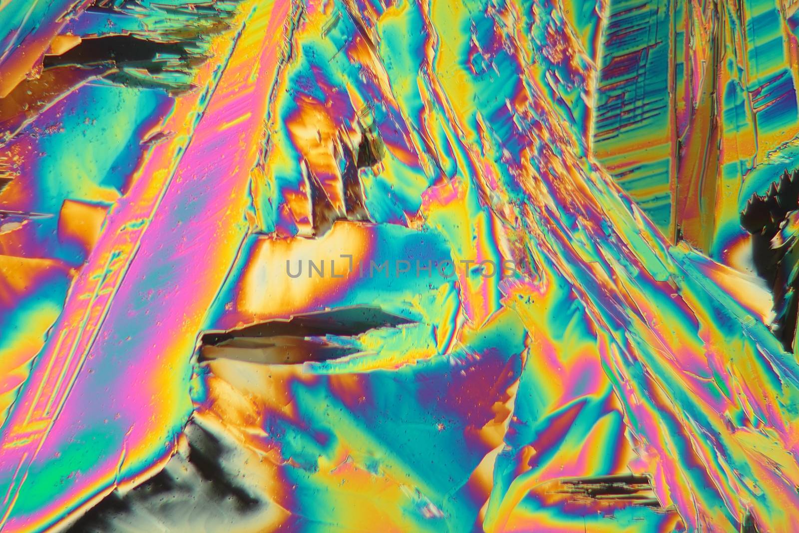 Holmium is a rare earth element and used for different applications in electronics, laser and glass coloring. The photo is made with a polarization microscope.