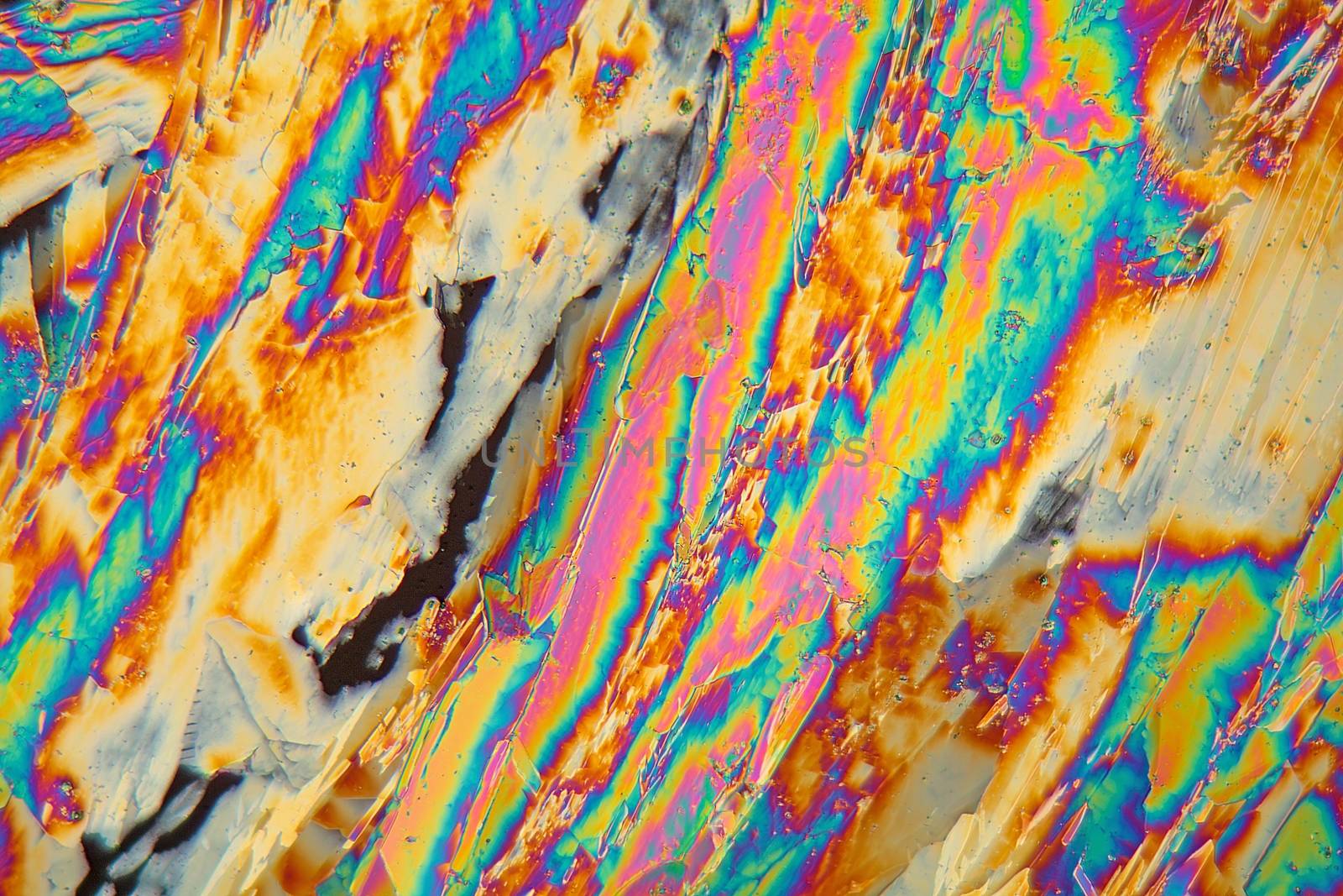 Holmium is a rare earth element and used for different applications in electronics, laser and glass coloring. The photo is made with a polarization microscope.