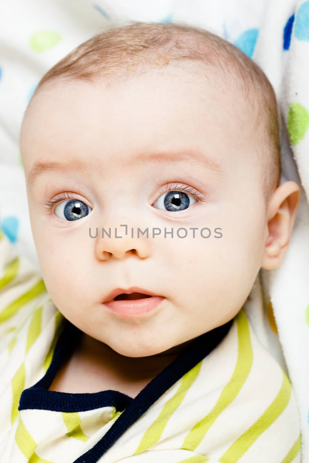 Adorable baby with blue eyes. studio photo