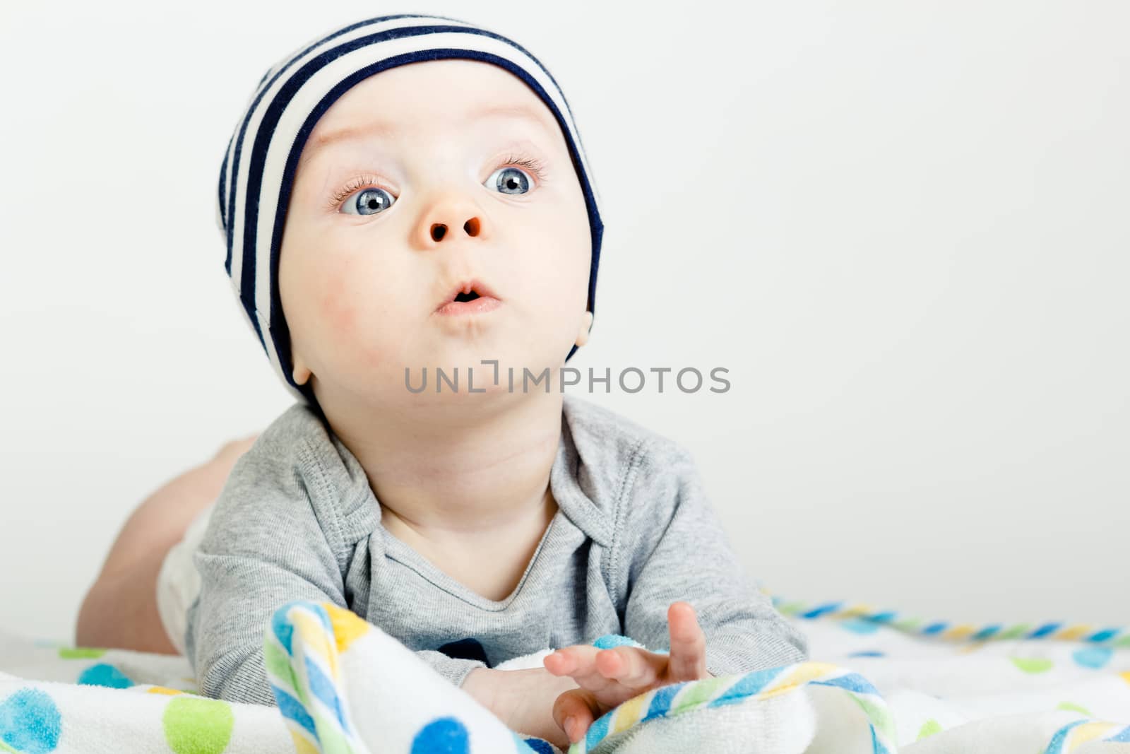 Adorable funny baby with blue eyes. studio photo