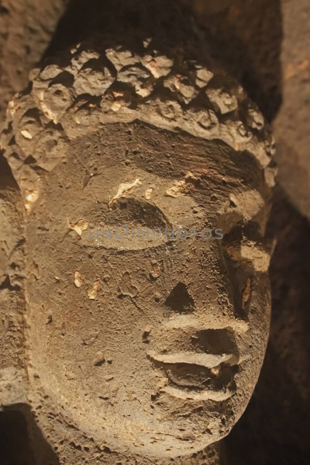 Close up face of calm Buddha, Ajanta Cave No. 26, Ajanta, Aurang by yands