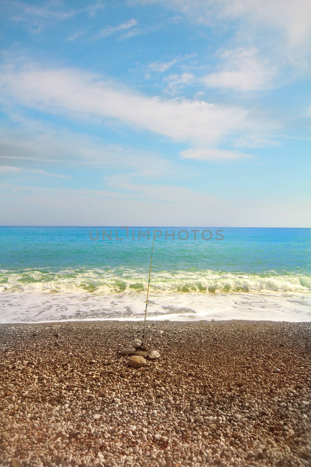 sea fishing in sea in summer among a beach