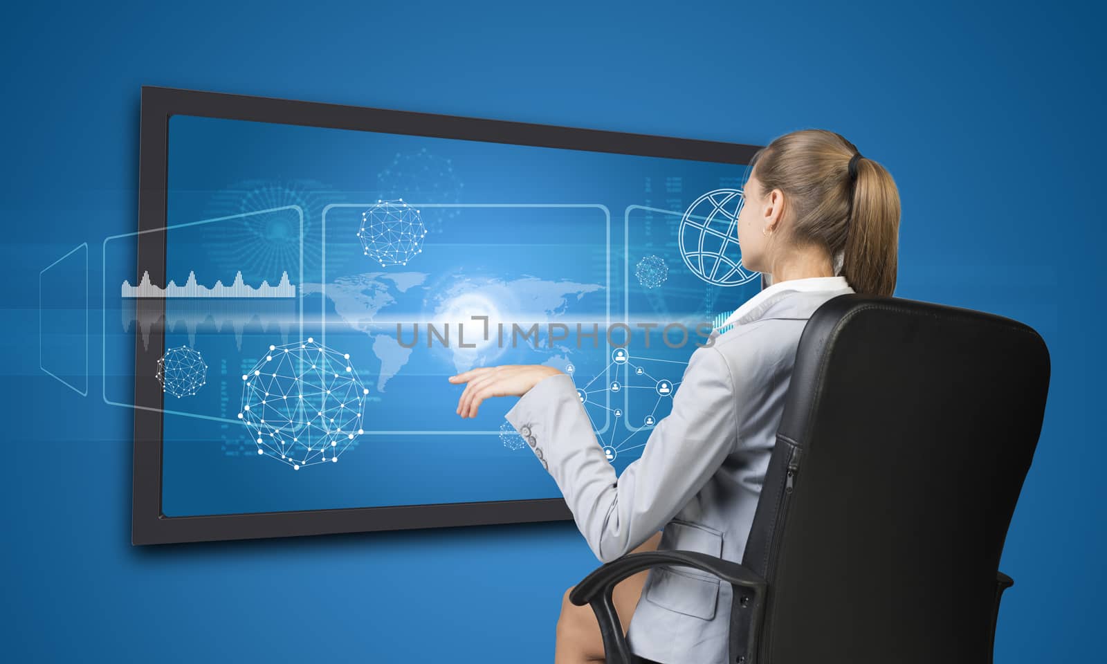 Businesswoman operating touch screen interface with world map, on blue background