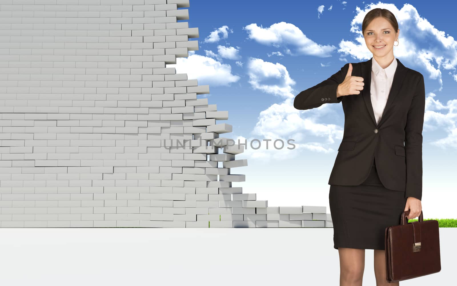 Businesswoman holding suitcase and showing thumb-up. Dilapidated brick wall, green meadow with sky as backdrop by cherezoff