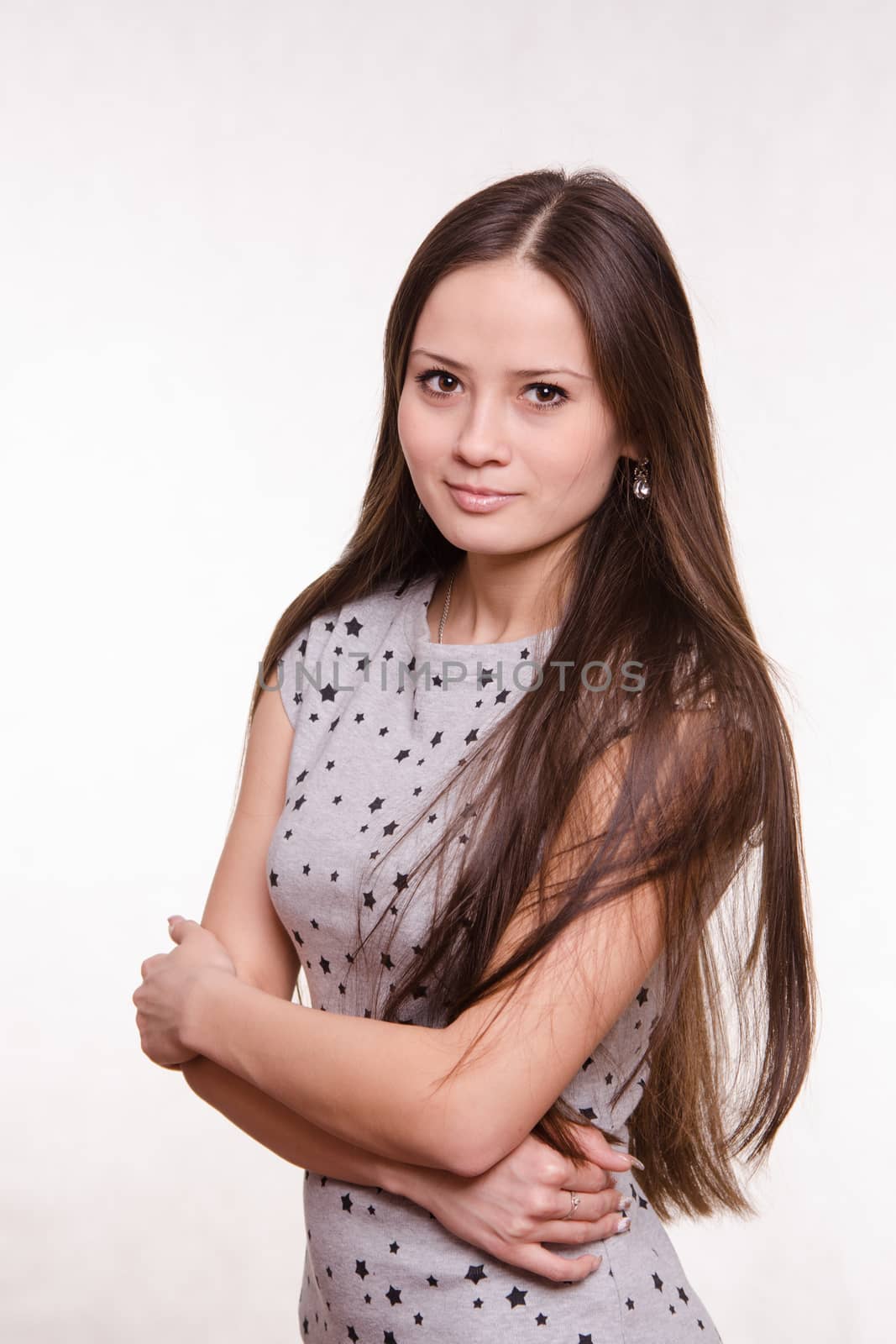 Portrait of a beautiful young woman of the European type on a white background