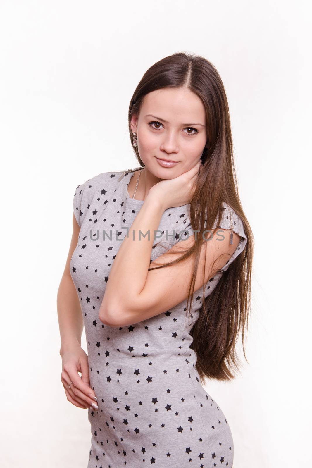 Portrait of a beautiful young woman of the European type on a white background