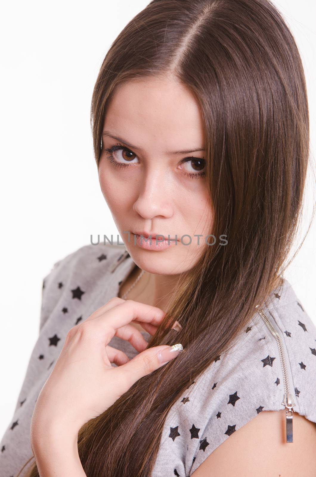 Portrait of a beautiful young woman of the European type on a white background