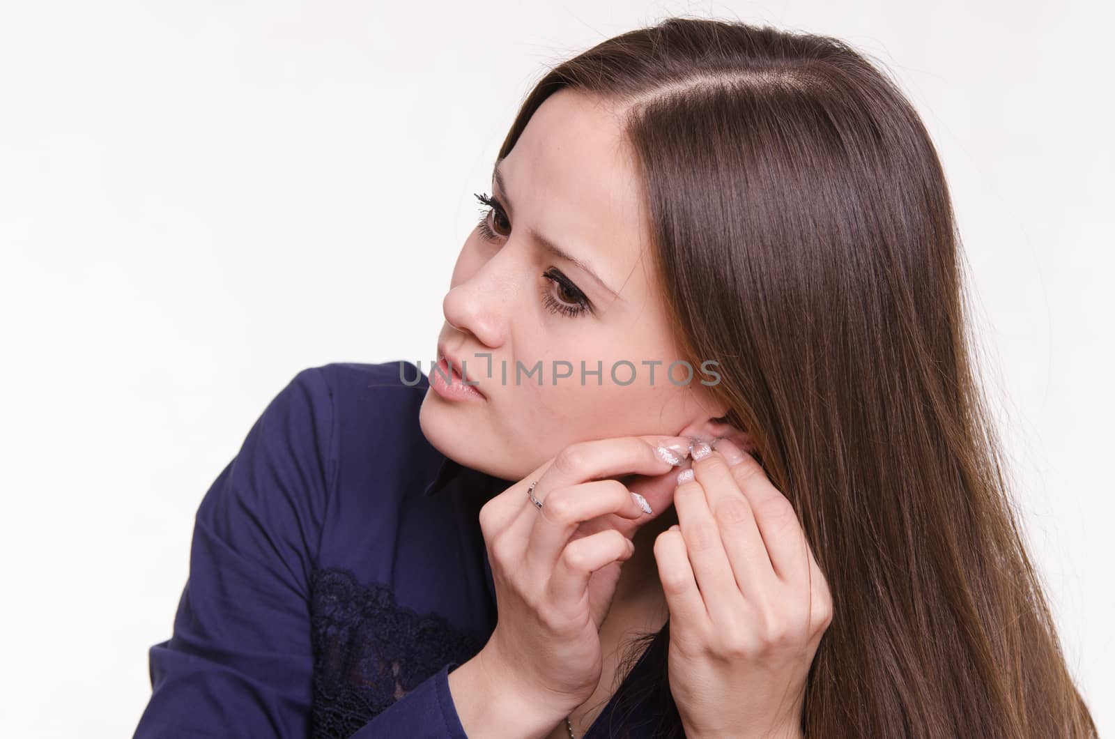 Portrait of a beautiful young woman of the European type on a white background