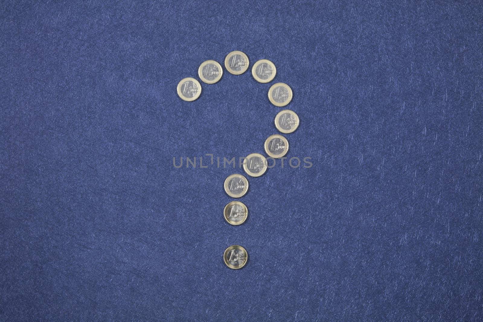 one Euro coin between five ten twenty fifty banknotes on blue background
 euro coins as a question mark on blue background