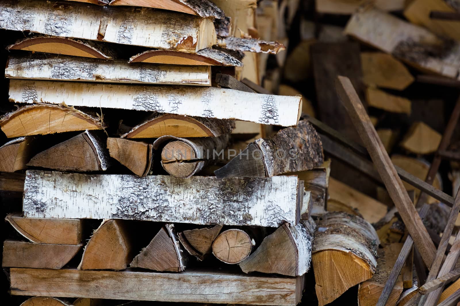 fuelwood for the winter. Pile of birch firewood