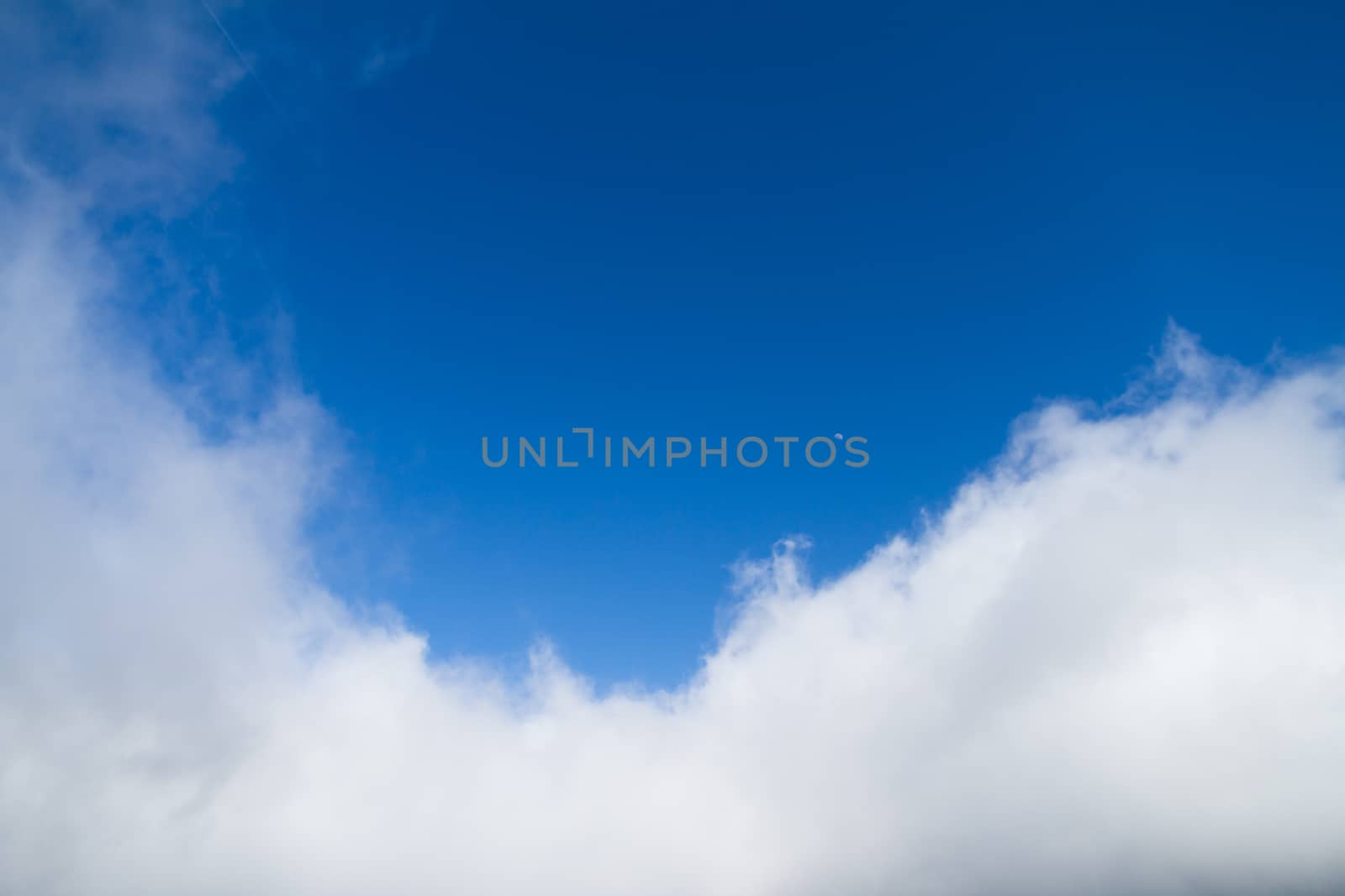 White clouds in blue sky.