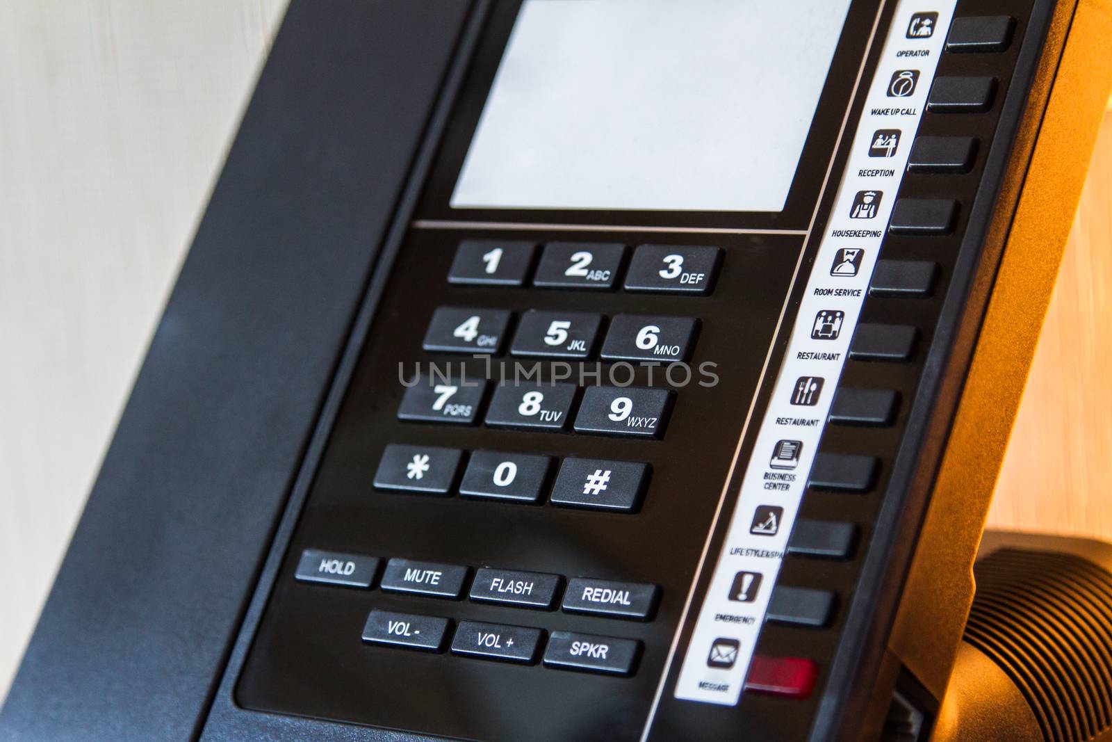 Telephone for customer service in hotel room.