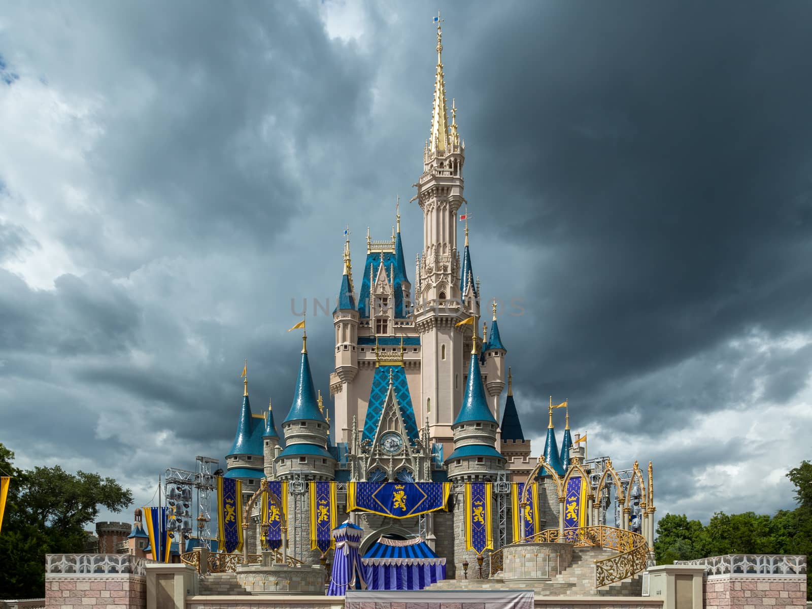 Orlando, Florida – Sept 4: The famous Disney Magic Kingdom Castle soars into the stormy clouds in Orlando, Florida, on September 4, 2014