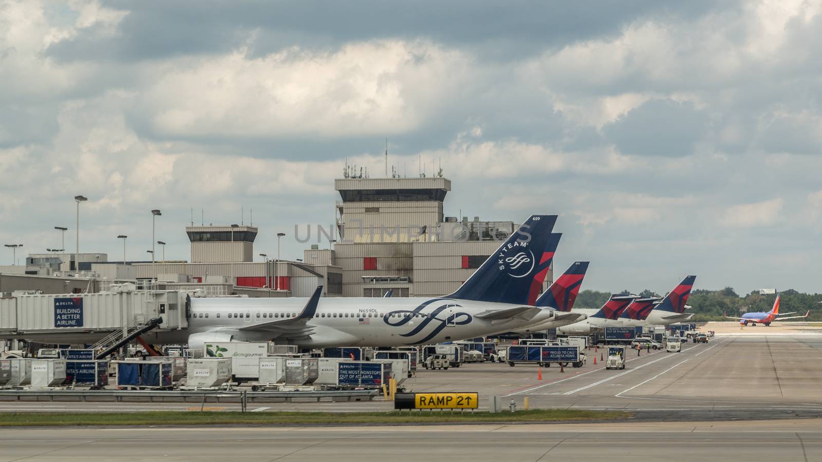 Atlanta - Aug 30: Several Delta airline planes load thousands of passengers at Atlanta International Airport on August 30, 2014 in Atlanta, Georgia.