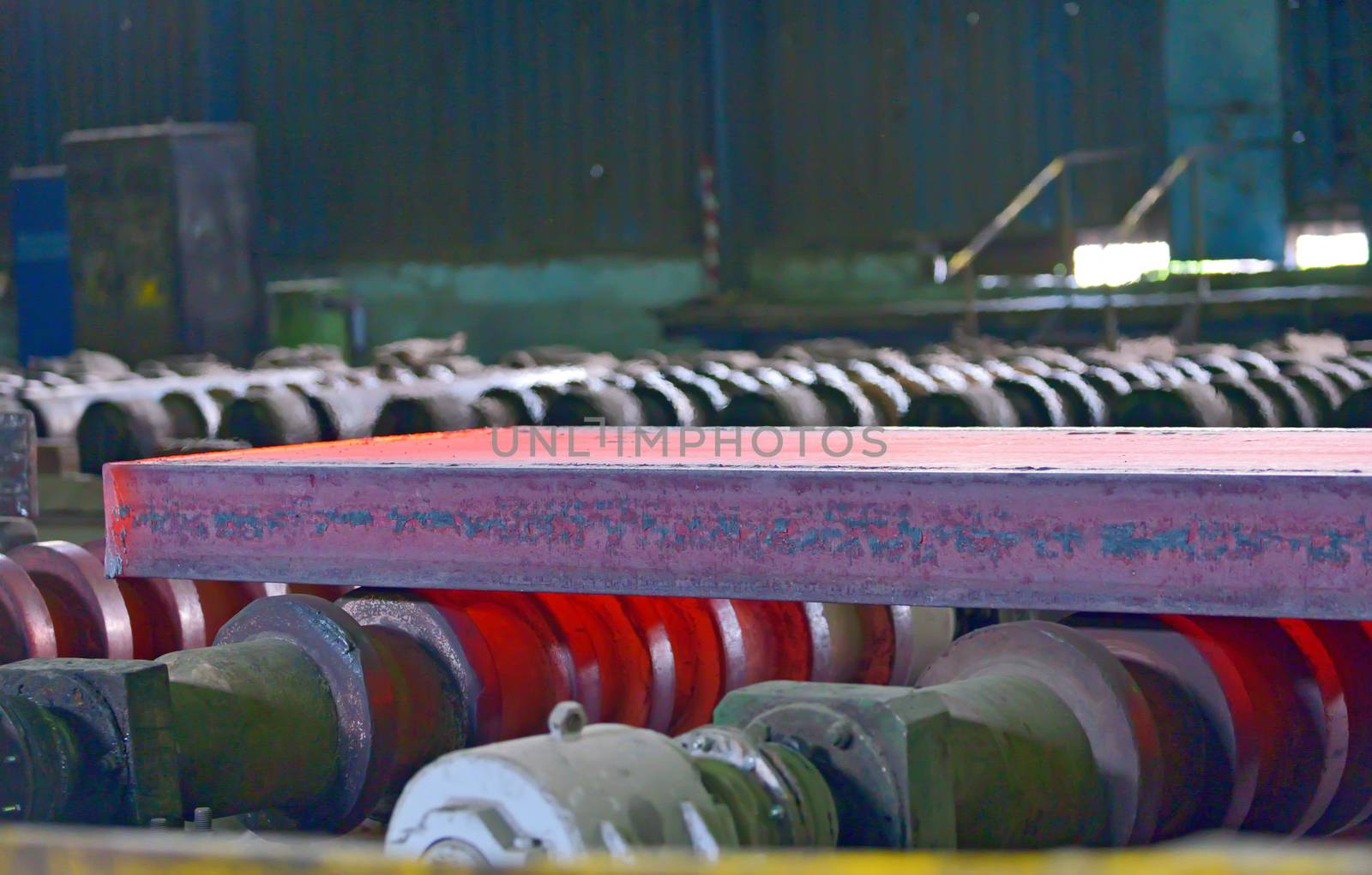 hot steel on conveyor inside of steel plant
