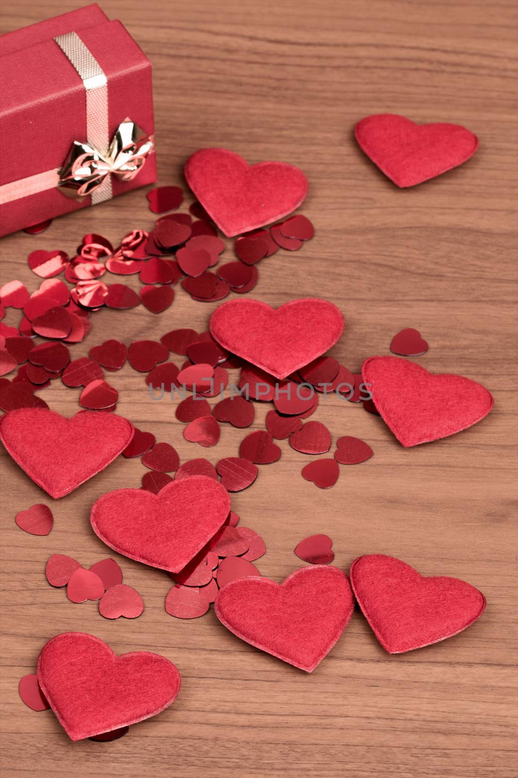 small red hearts confetti and present box full of hearts, valentine love concept