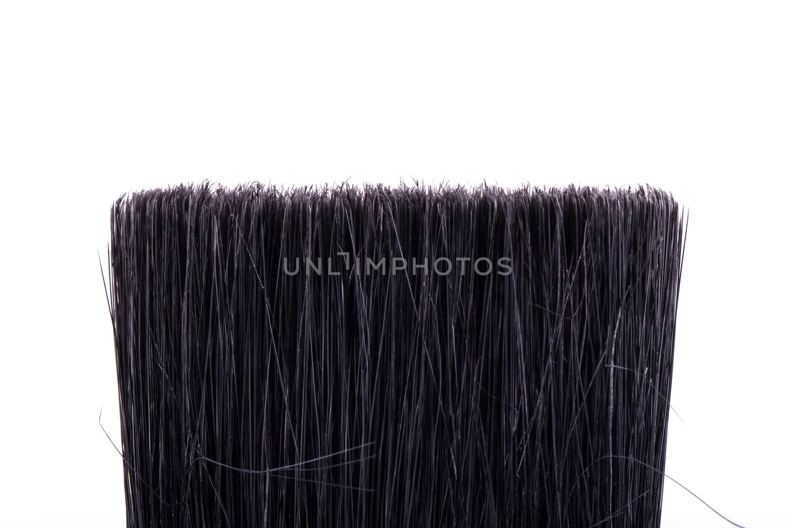 Detail view of paint brush, isolated on white background.