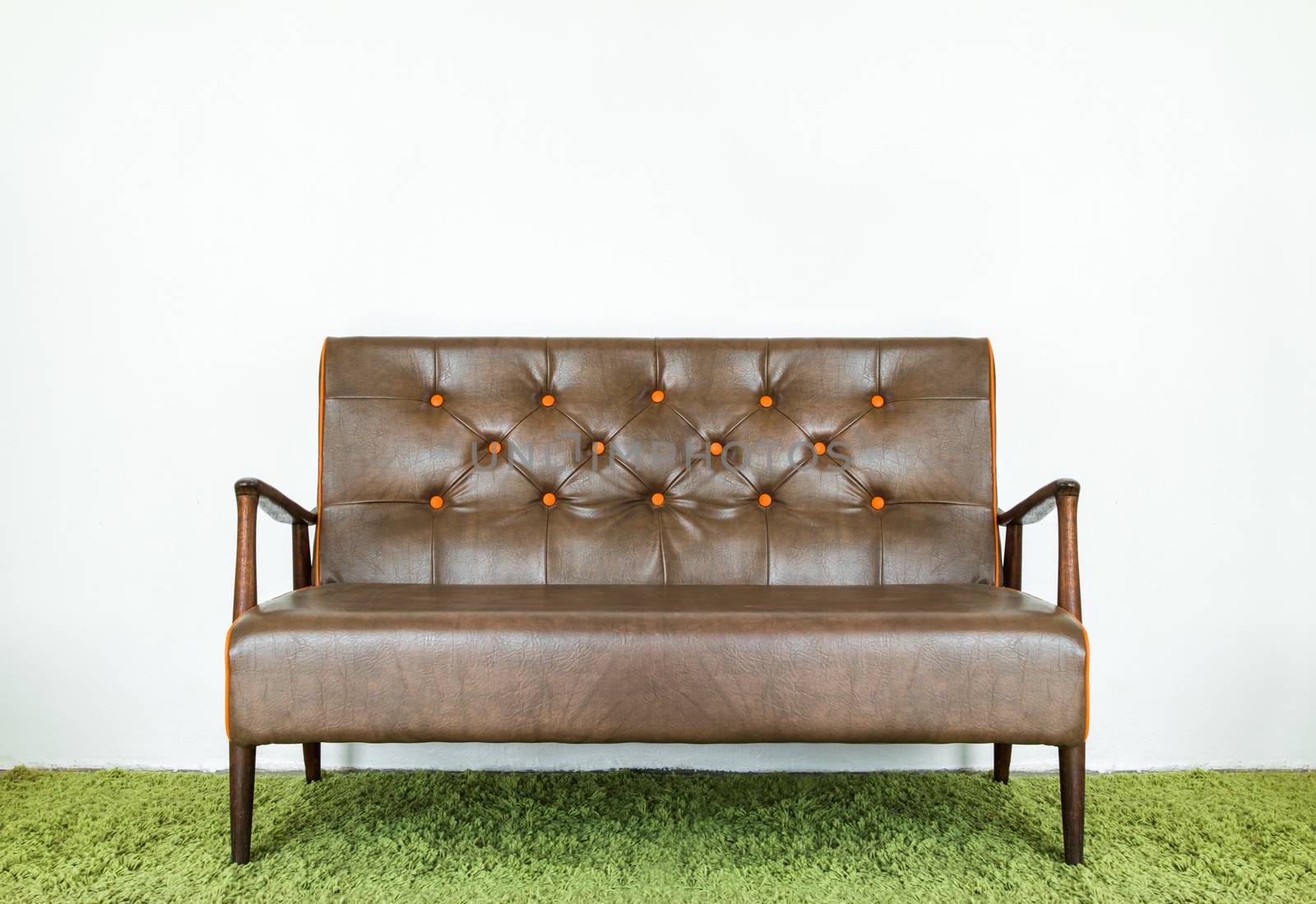 Vintage leather sofa with brown and made of solid wood.