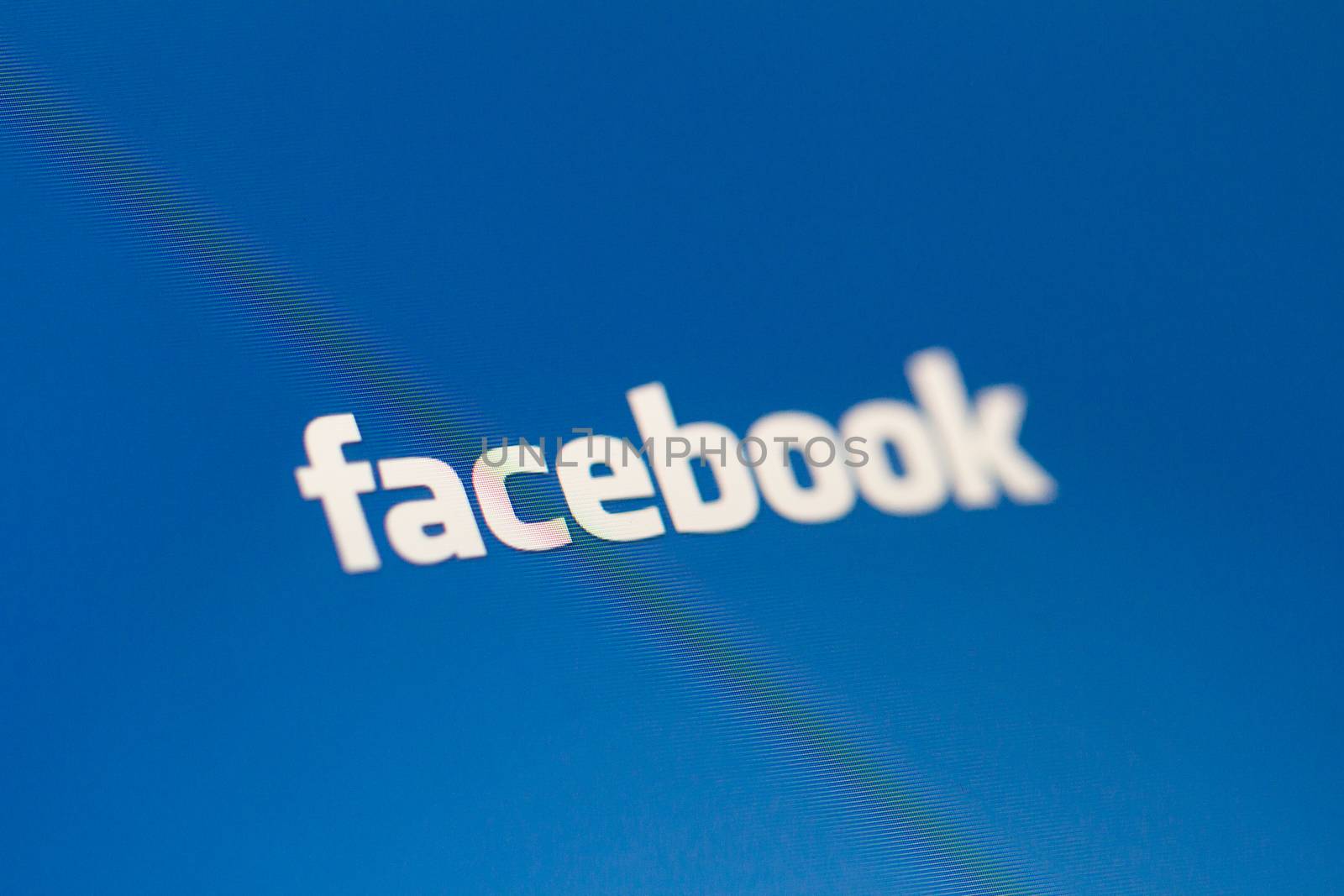 ISTANBUL, TURKEY - MARCH 16, 2013: Photo of Facebook logo on tablet. Facebook is the largest social media network and owned by Facebook, Inc.