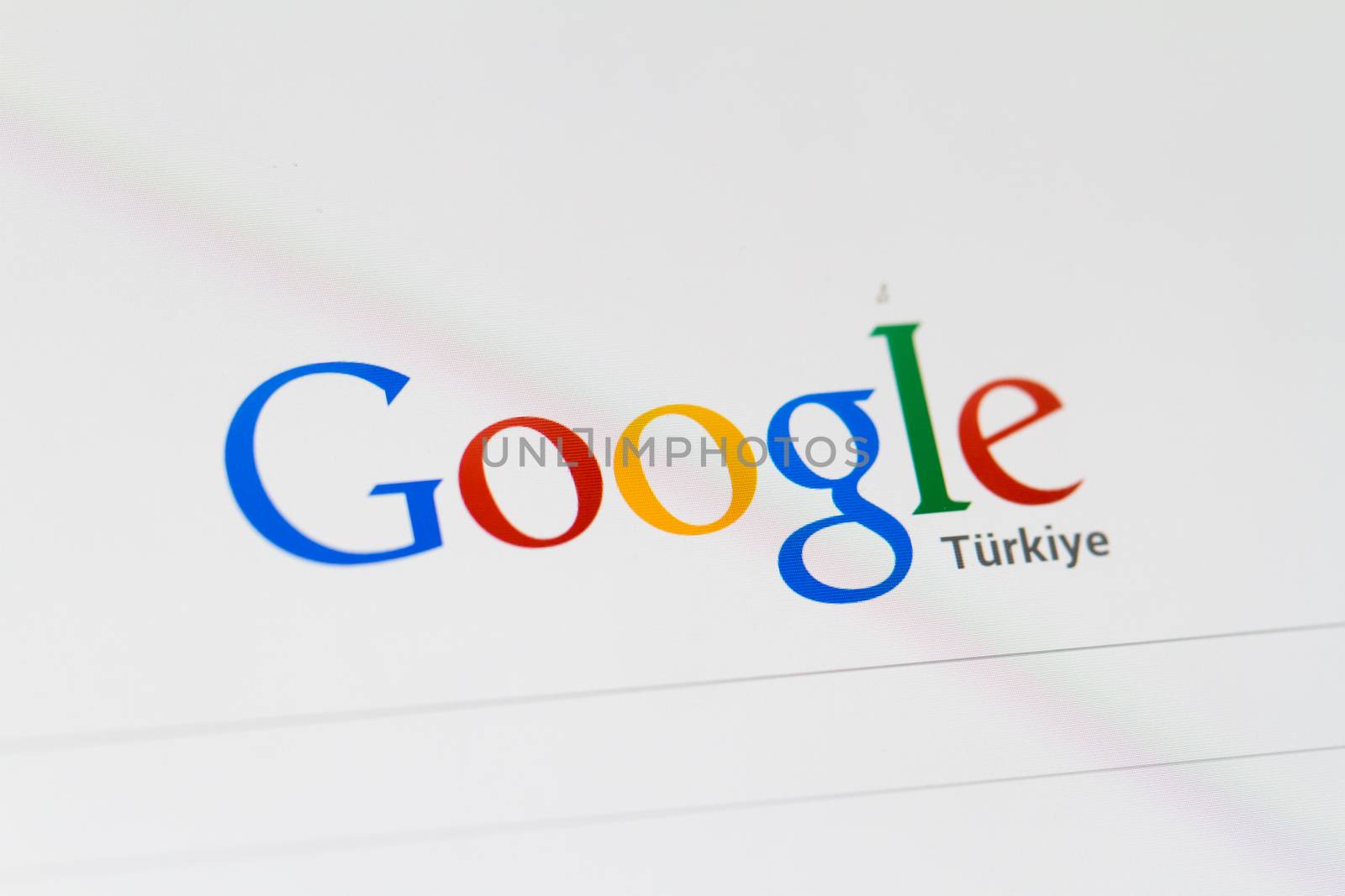 ISTANBUL, TURKEY - MARCH 16, 2013: Photo of Google.com search home page and logo on tablet.  Google is an American multinational corporation with different services and products.