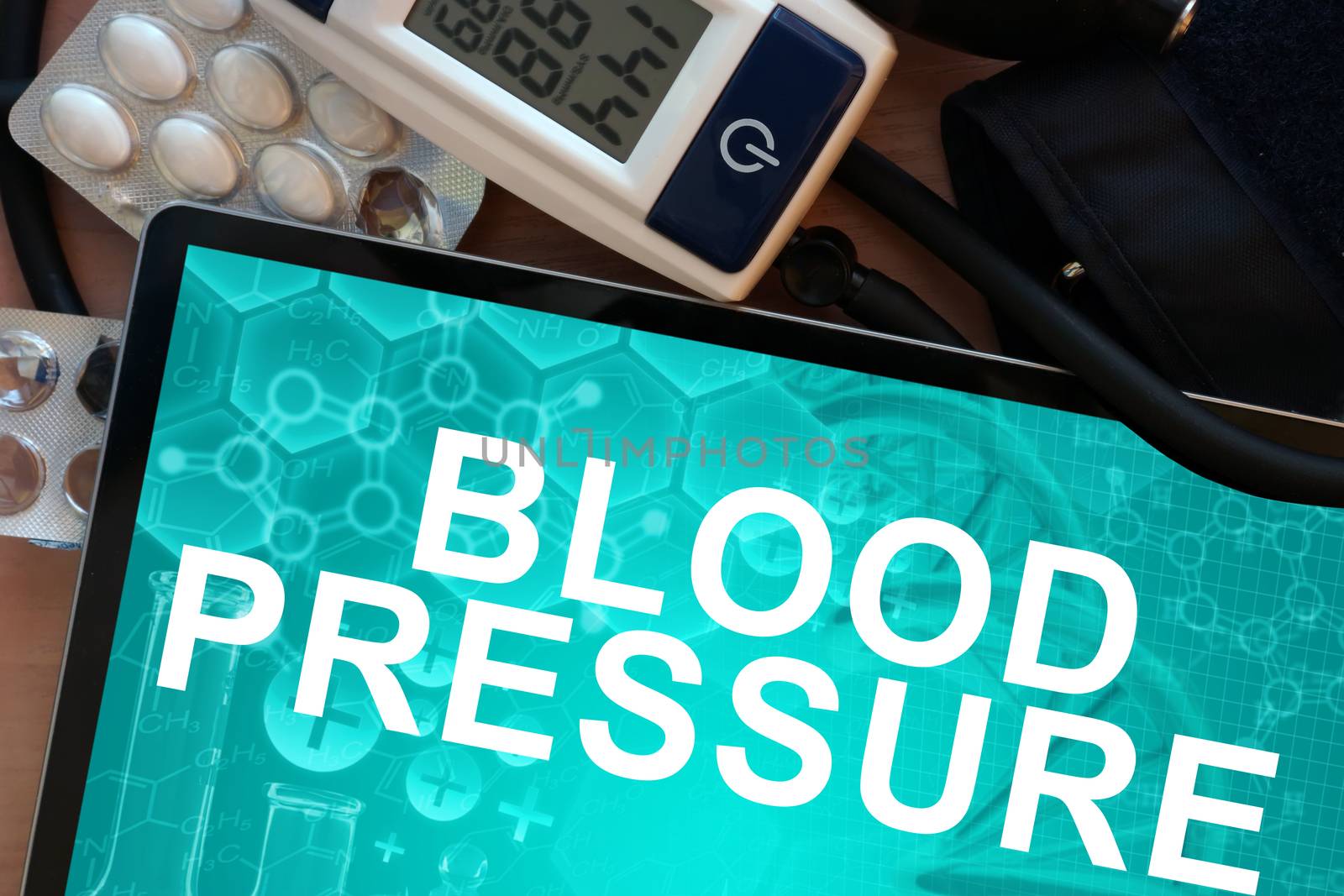 Tablet with the words blood pressure and Electronic blood pressure monitor