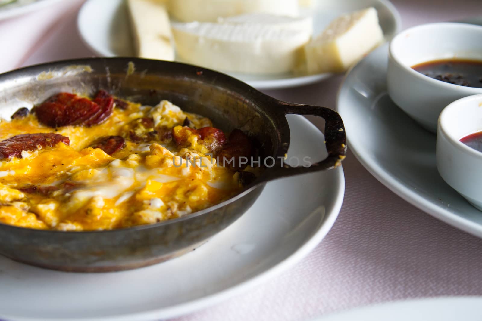 Breakfast service, egg on white plate.