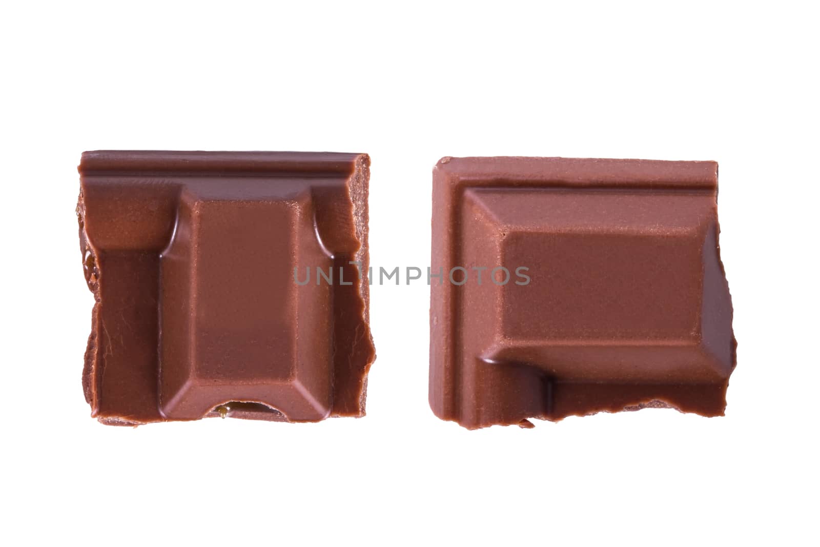 Top view of chocolate bar pieces, isolated on white background.