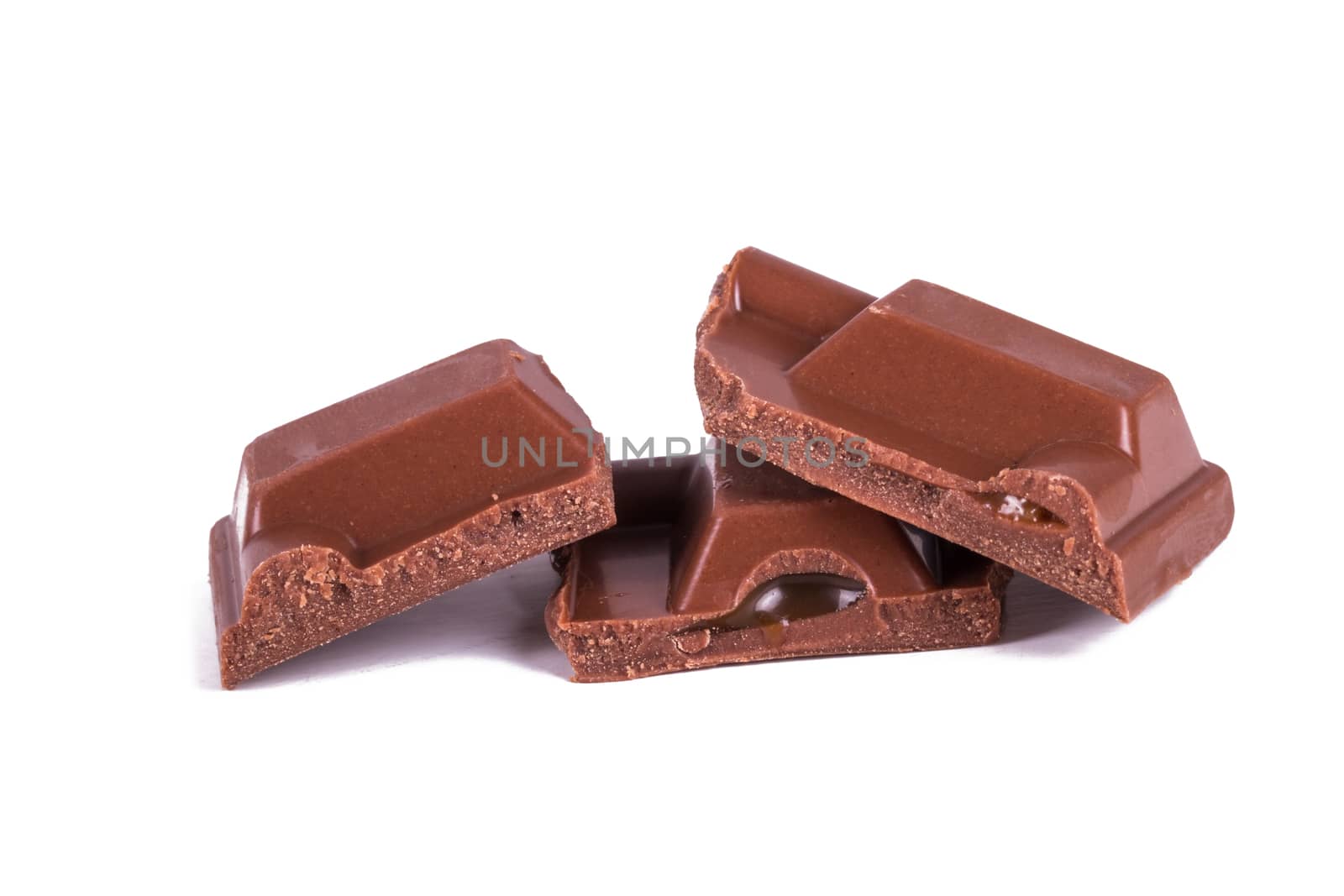 Chocolate bar pieces, isolated on white background.