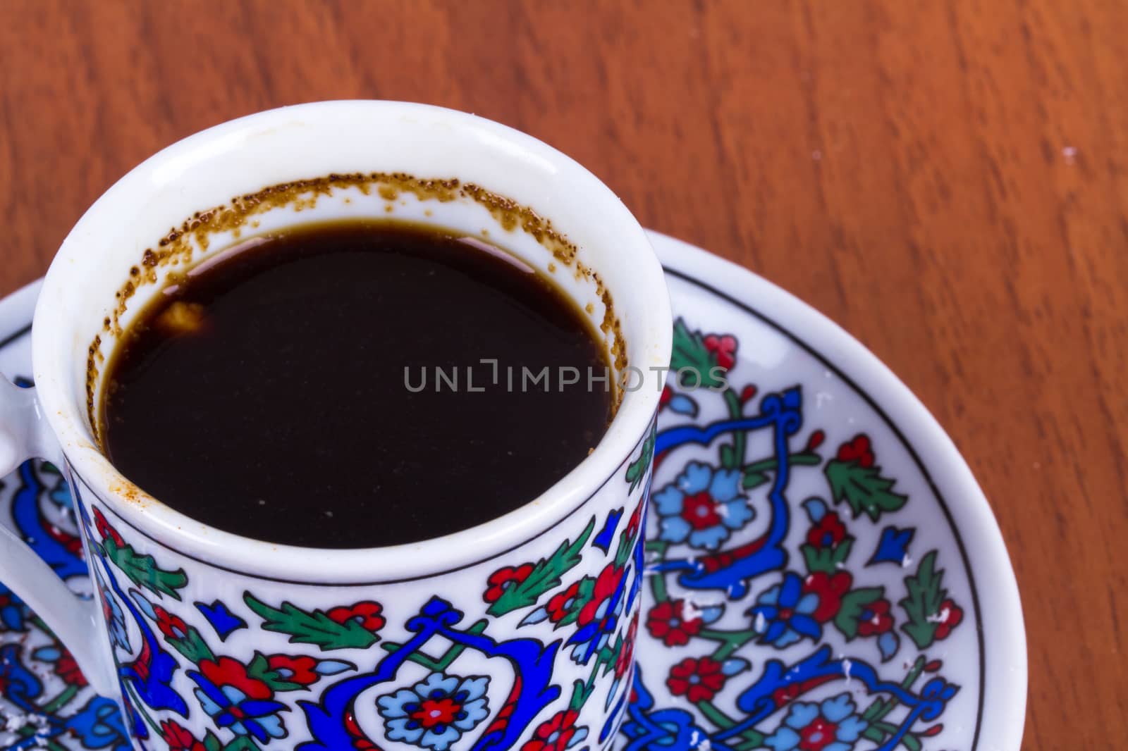 Close up view of Turkish coffee on wooden table.