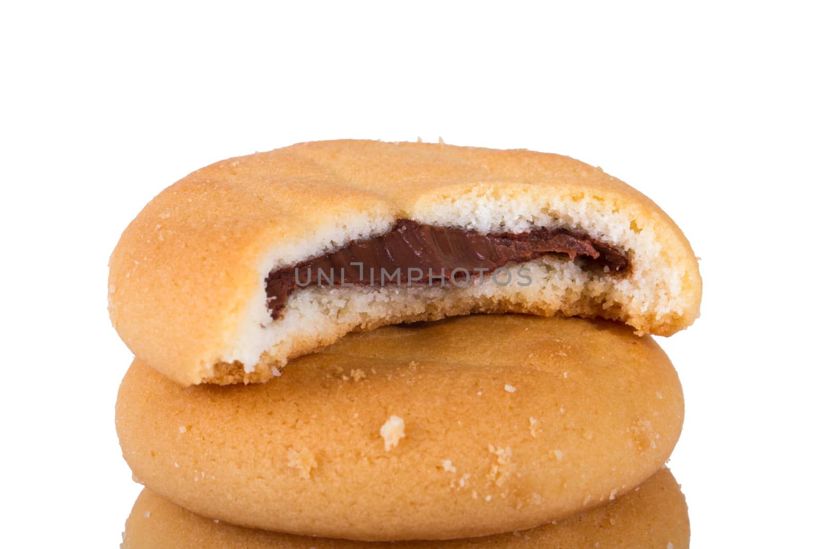Close up view of bitten biscuit cookie, isolated on white background.