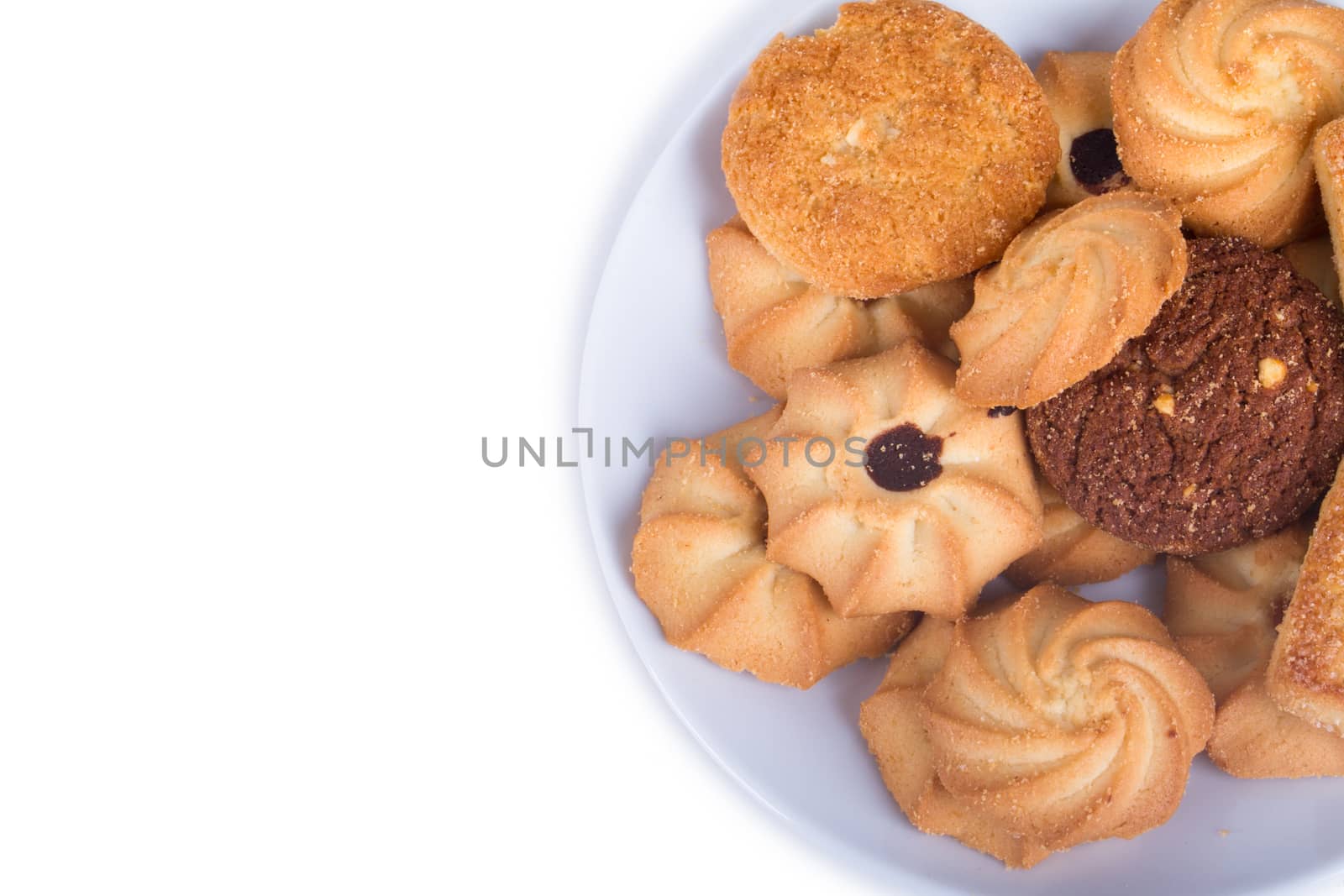 Heap of cookie chips with copy space, isolated on white background.
