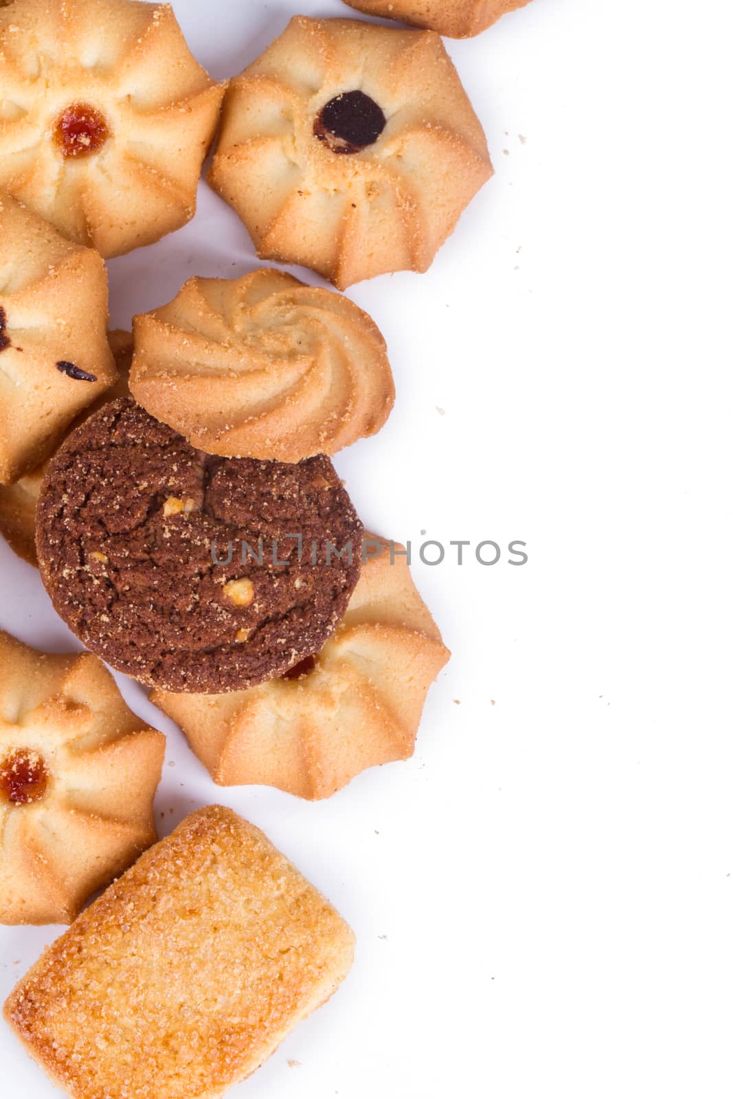 Heap of cookie chips with copy space, isolated on white background.