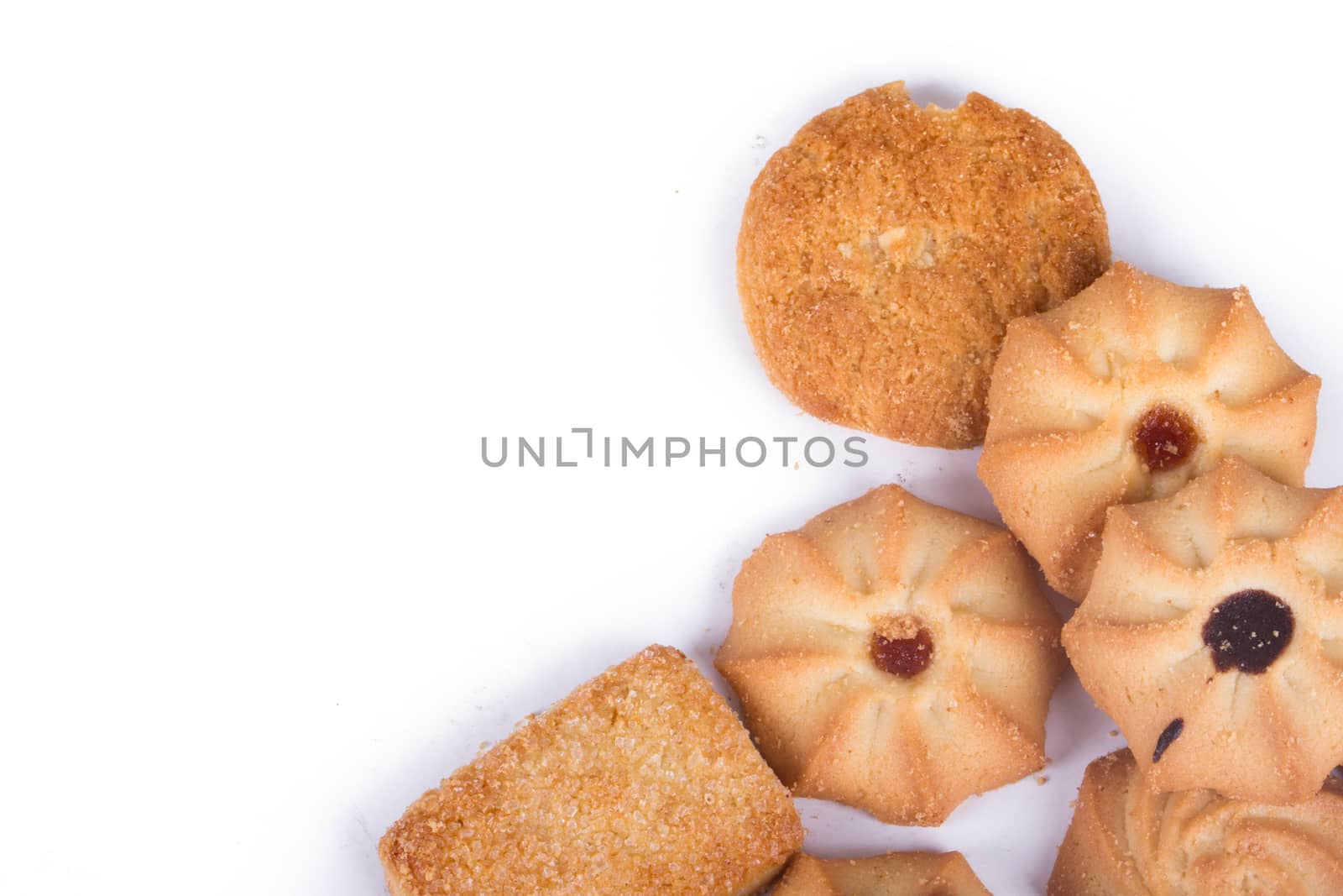 Heap of cookie chips with copy space, isolated on white background.