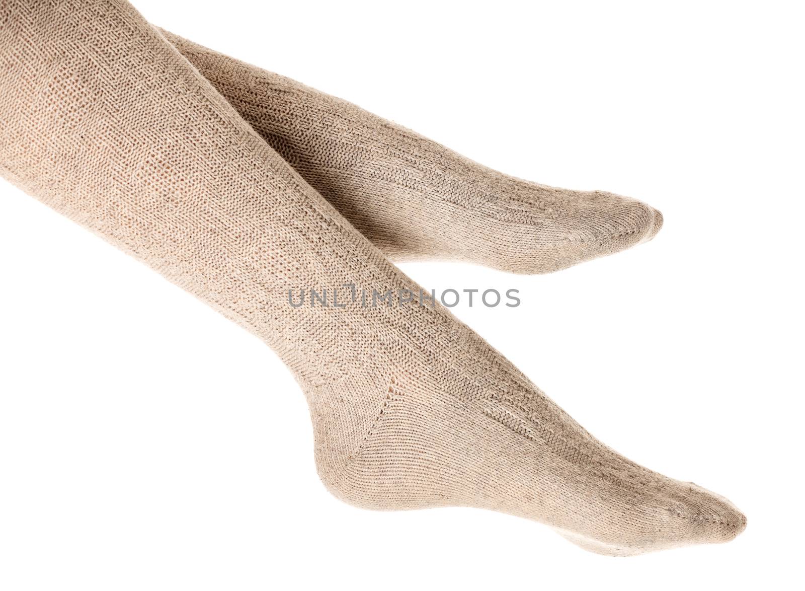 Female legs in knitted socks by Nobilior