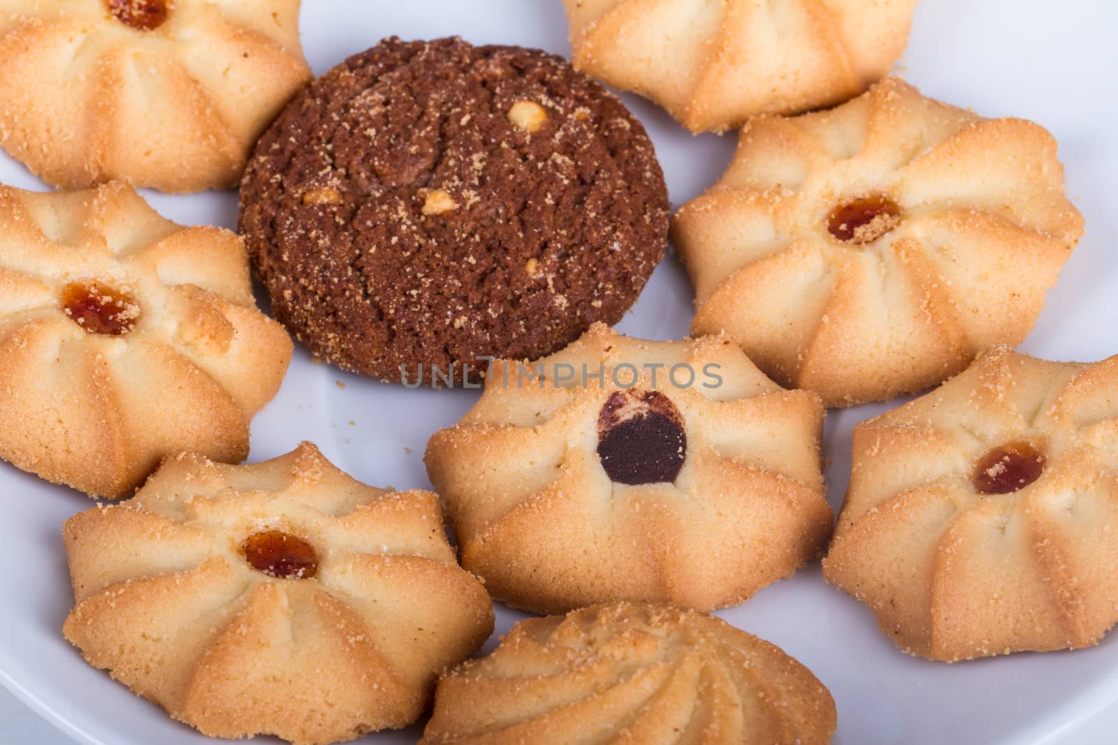Heap of cookie chips on white.
