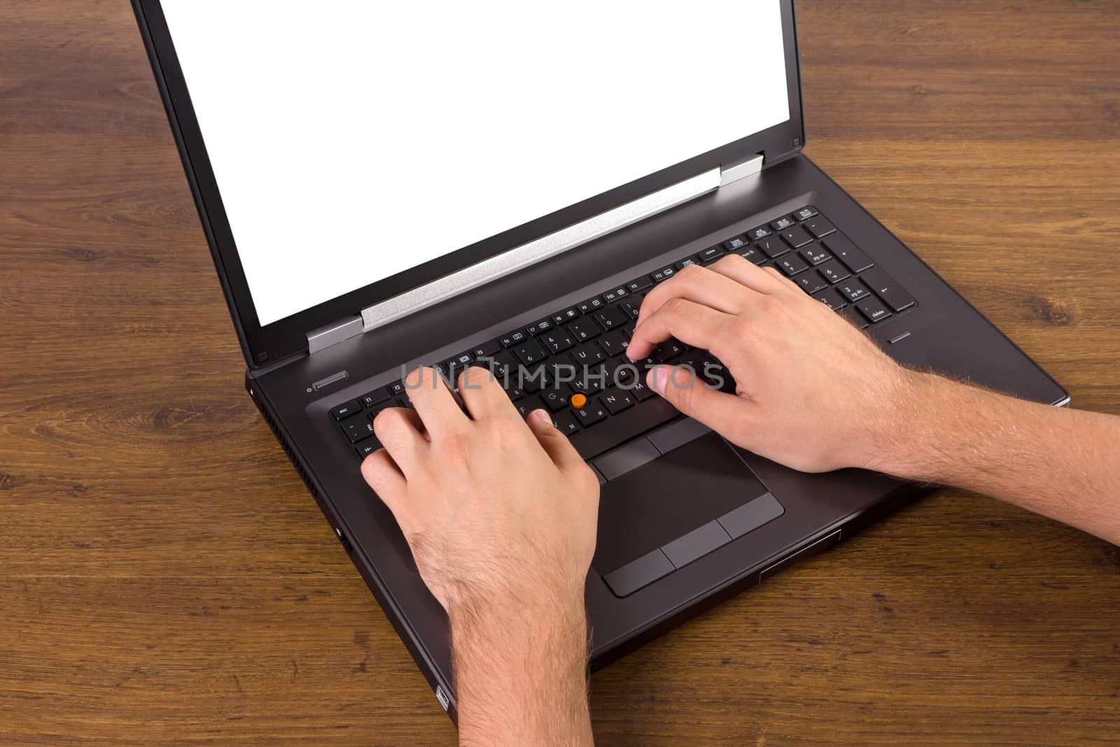 laptop with white screen on wooden background