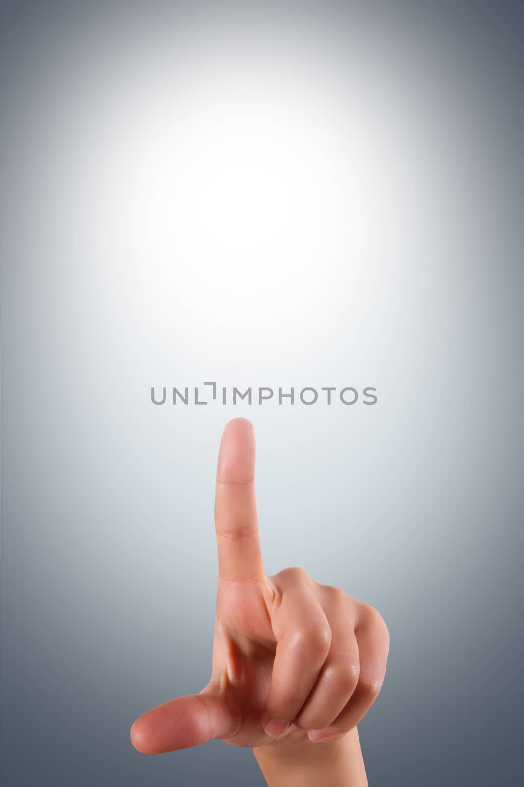 Young female hand finger touching or pressing on air screen on dark background.