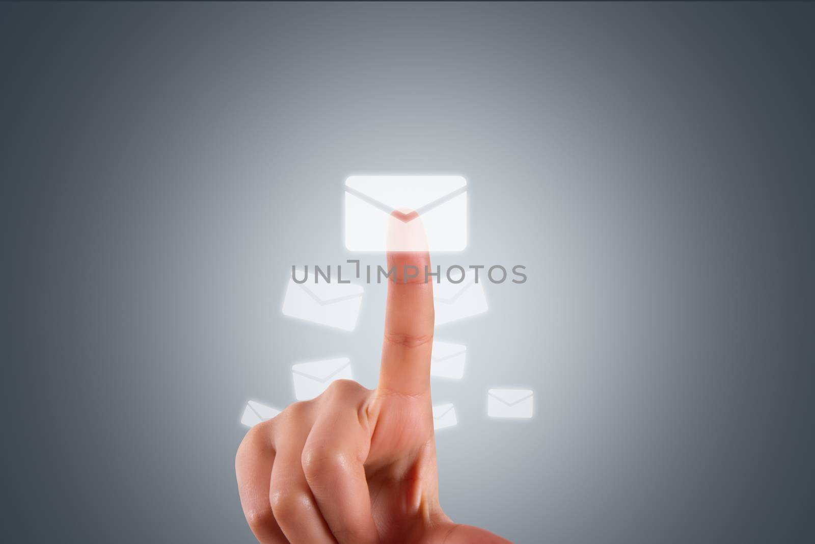 Communication concept, young female hand finger touching, pressing modern email button on digital screen interface on dark background.