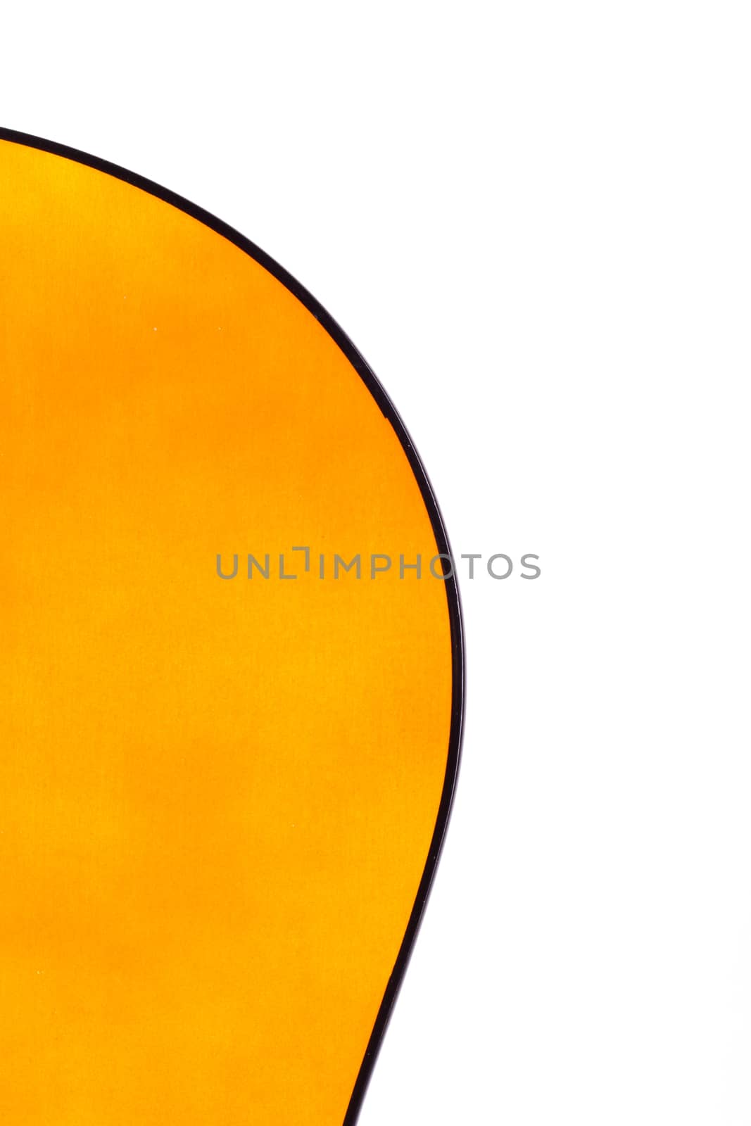 Detail view of yellow wooden classical acoustic guitar, isolated on white background.