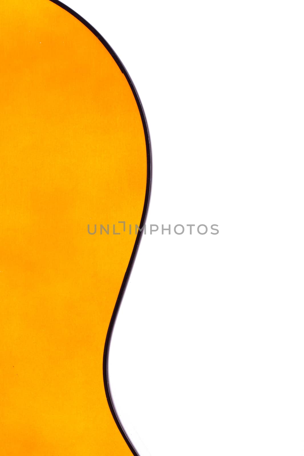 Detail view of yellow wooden classical acoustic guitar, isolated on white background.
