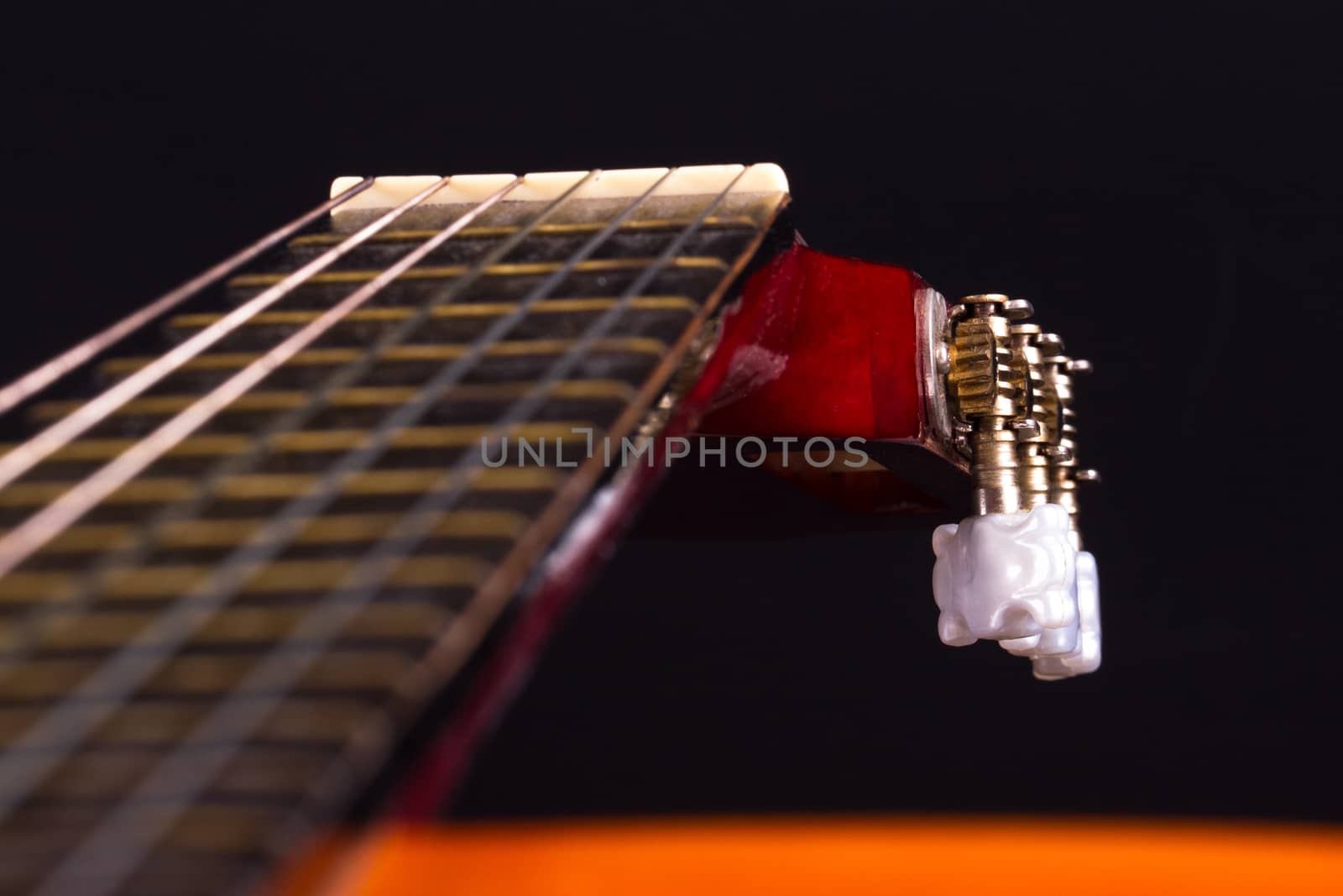 Detail view of fingerboard on classical guitar.