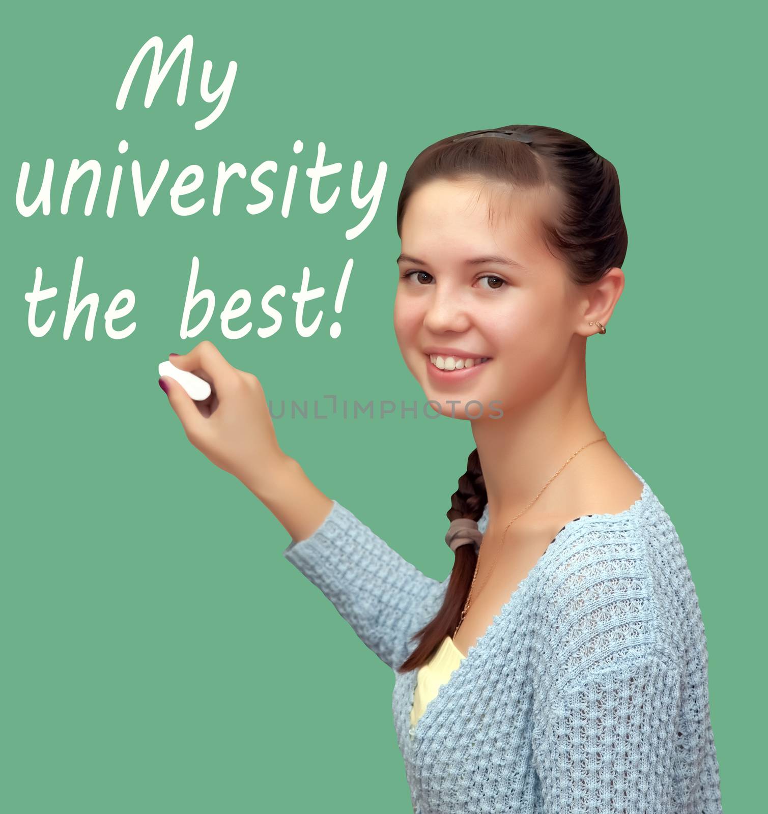 Girl student writes chalk "My university the best!". Isolated on a green background.